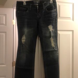 Never worn. Ripped jeans.